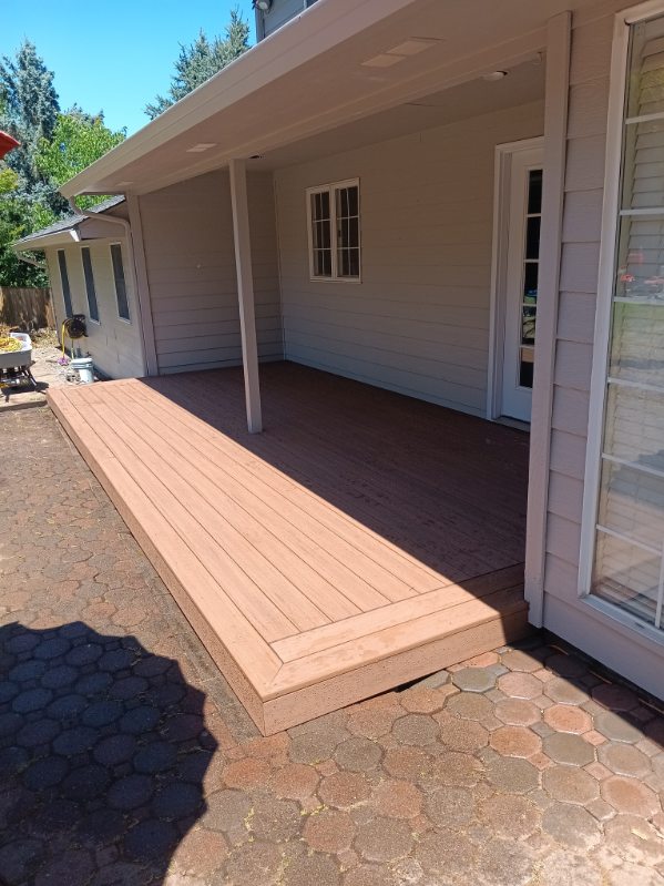 Covered ground-level composite deck built in Beaverton, Oregon by 360 Custom Construction, vetted by On Top Home Services