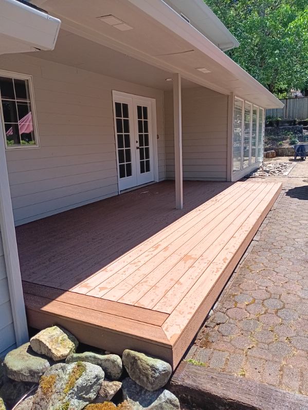 Covered ground-level deck along the back of a home in Salem, Oregon, built by 360 Custom Construction and vetted by On Top Home Services