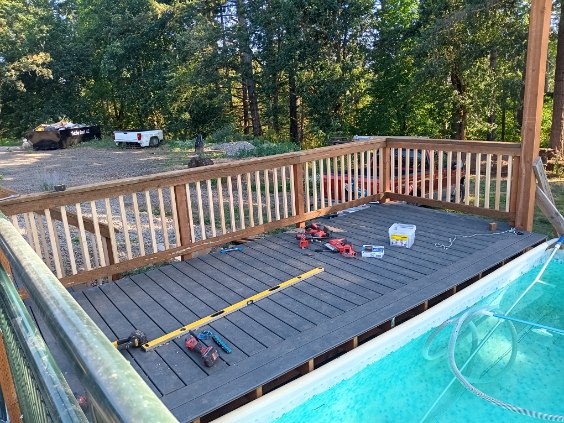 Composite pool deck with cedar railing built in Silverton, Oregon by 360 Custom Construction, vetted by On Top Home Services
