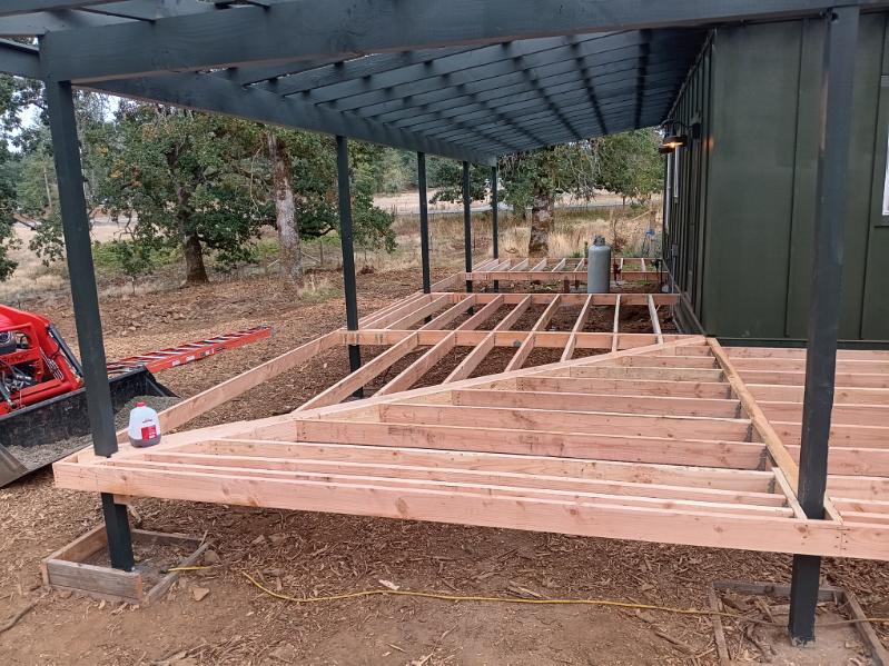 Deck framing under a covered porch on a farm-country build in Woodburn, Oregon by 360 Custom Construction, vetted by On Top Home Services