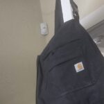 Fluid resistant coveralls - pressure washing