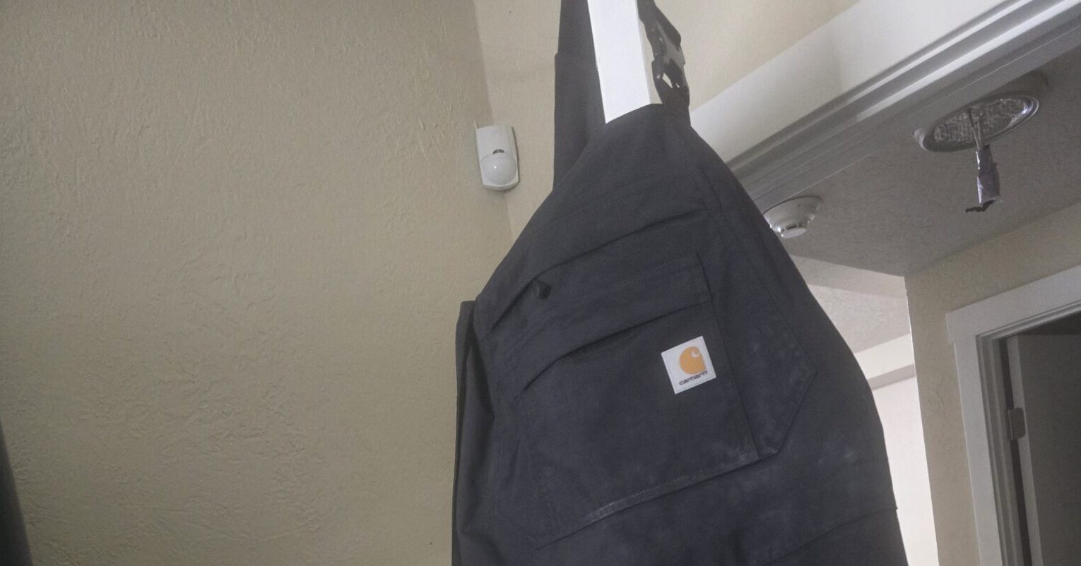 Fluid resistant coveralls - pressure washing